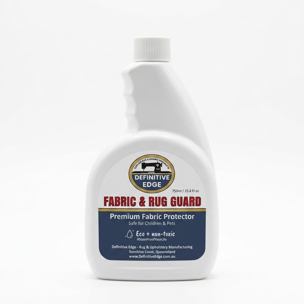 Fabric and rug guard bottle with Definitive Edge logo on a white background