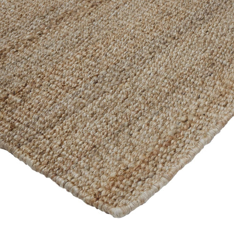 Close-up of a beige carpet corner on a white background