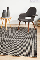 Black and white rug on timber flooring