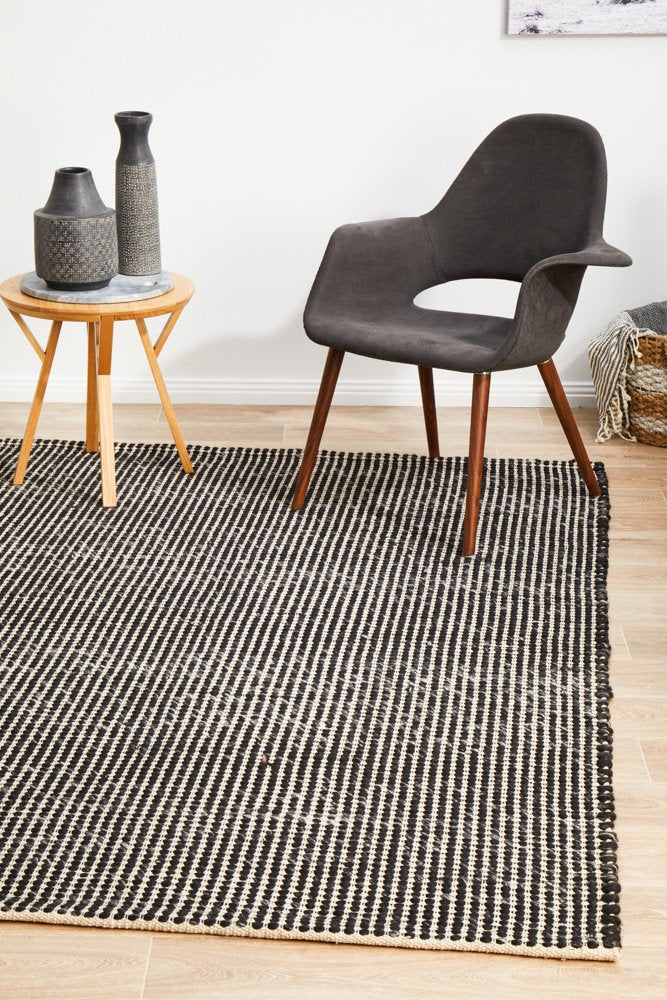 Black and white rug on timber flooring