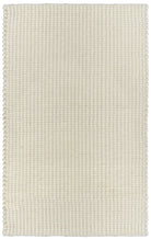 A white, handwoven rug with a textured looped design, made from a blend of wool, viscose, and cotton.