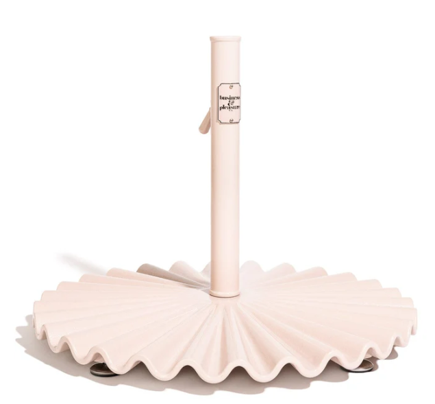 White umbrella stand with a scalloped base on a white background