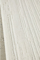 Close-up of a textured white surface with horizontal lines