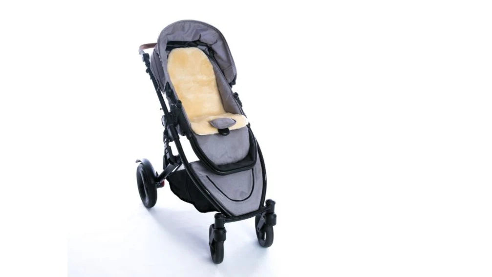 Gray and beige stroller on a white background