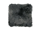 Gray sheepskin wool pillow on a white background
