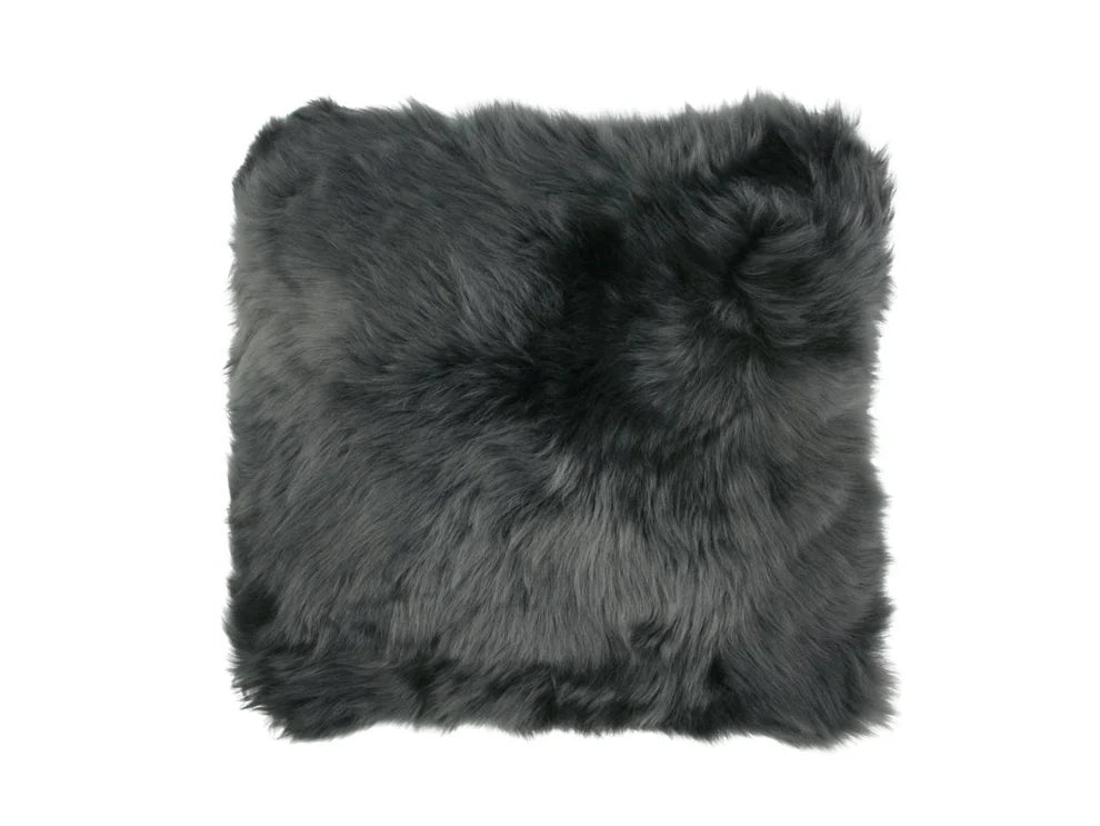 Gray sheepskin wool pillow on a white background