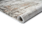 Rolled-up area rug with a textured pattern on a white background
