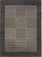 Gray geometric patterned rug on a plain background
