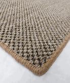 Close-up of a textured beige rug with a white background