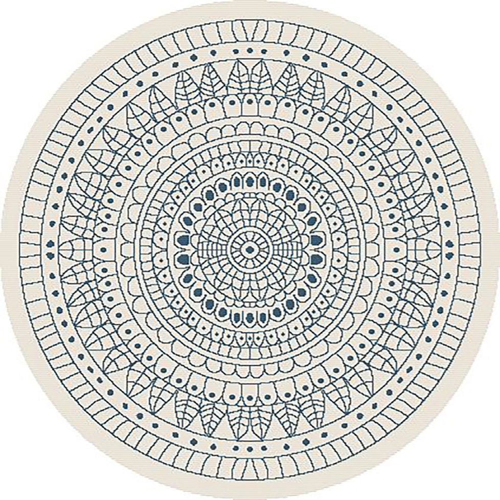 Round rug with a detailed blue mandala pattern on a white background