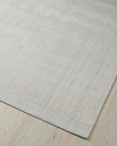 Visual of the rug's cotton backing, indicating its durability and stability on the floor