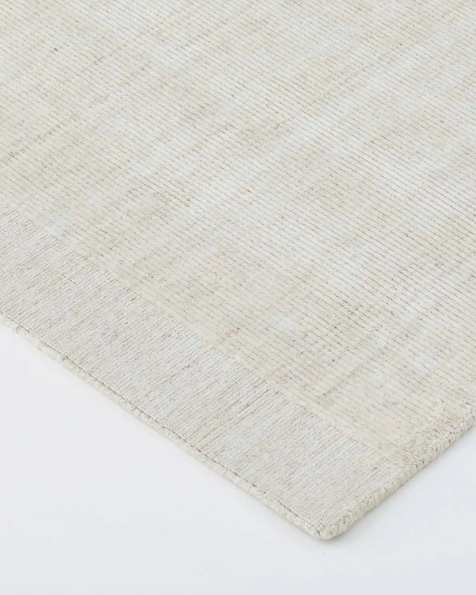 Close-up of the rug's ribbed texture, showcasing the quality of the viscose and wool blend.