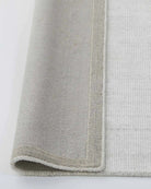 Edge and backing detail of the Travertine Rug, showcasing its quality construction and durable design.