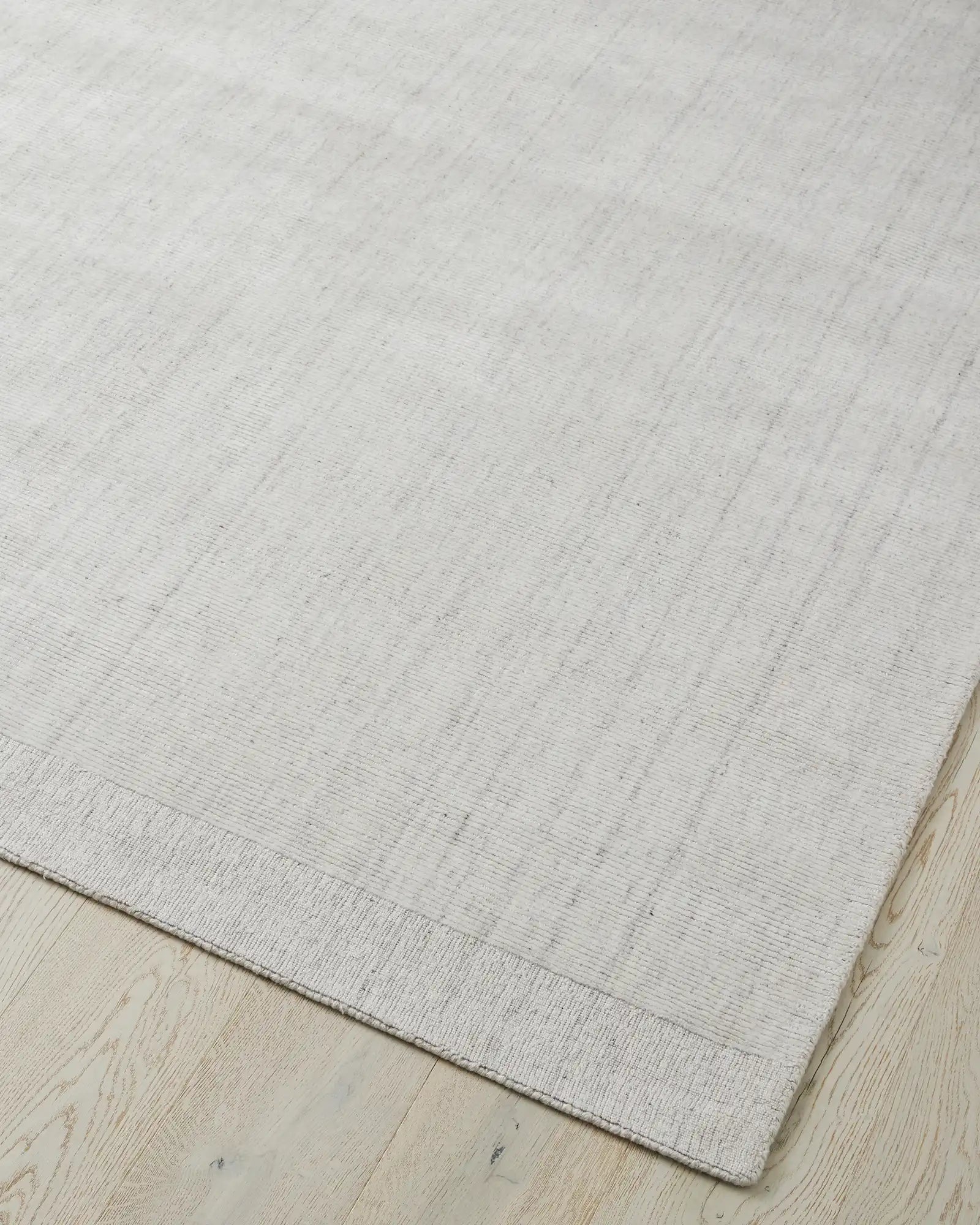 Edge and backing detail of the Travertine Rug, showcasing its quality construction and durable design