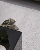 Photo capturing the plush feel and intricate weaving of the rug, illustrating its luxurious comfort and style.