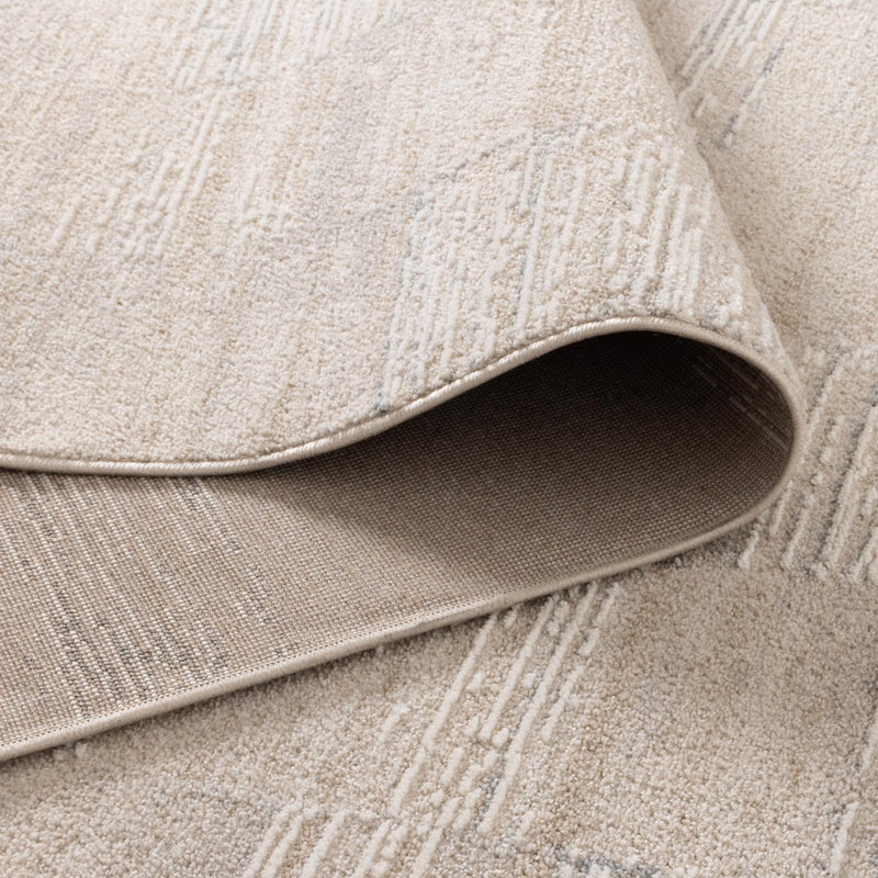 Close-up of a textured beige rug with a slight pattern