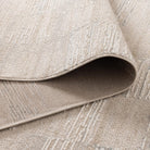 Close-up of a textured beige rug with a slight pattern