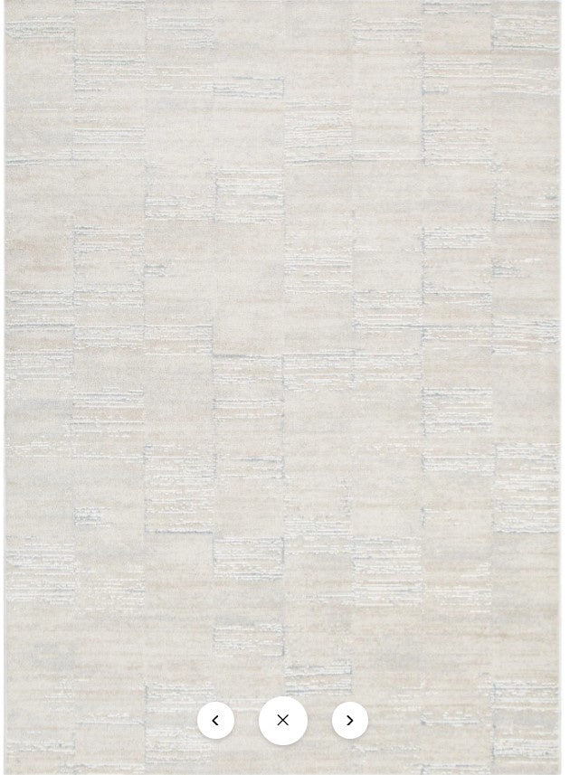 Textured beige wallpaper with a subtle pattern