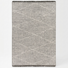 A rectangular woven throw blanket with a textured gray and beige geometric diamond pattern and dark fringe on the top and bottom edges, shown against a plain white background.