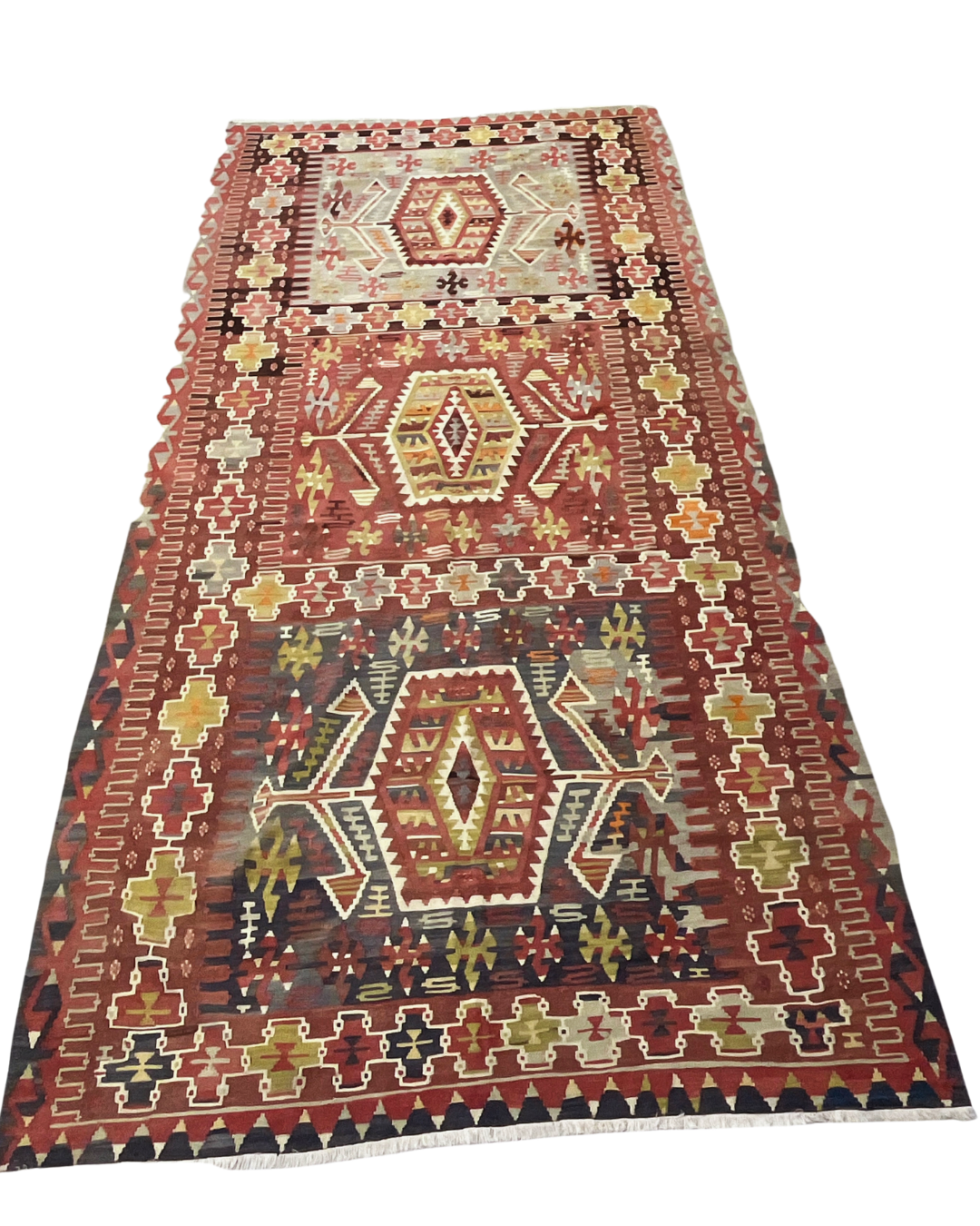 Decorative rug with geometric pattern on a white background