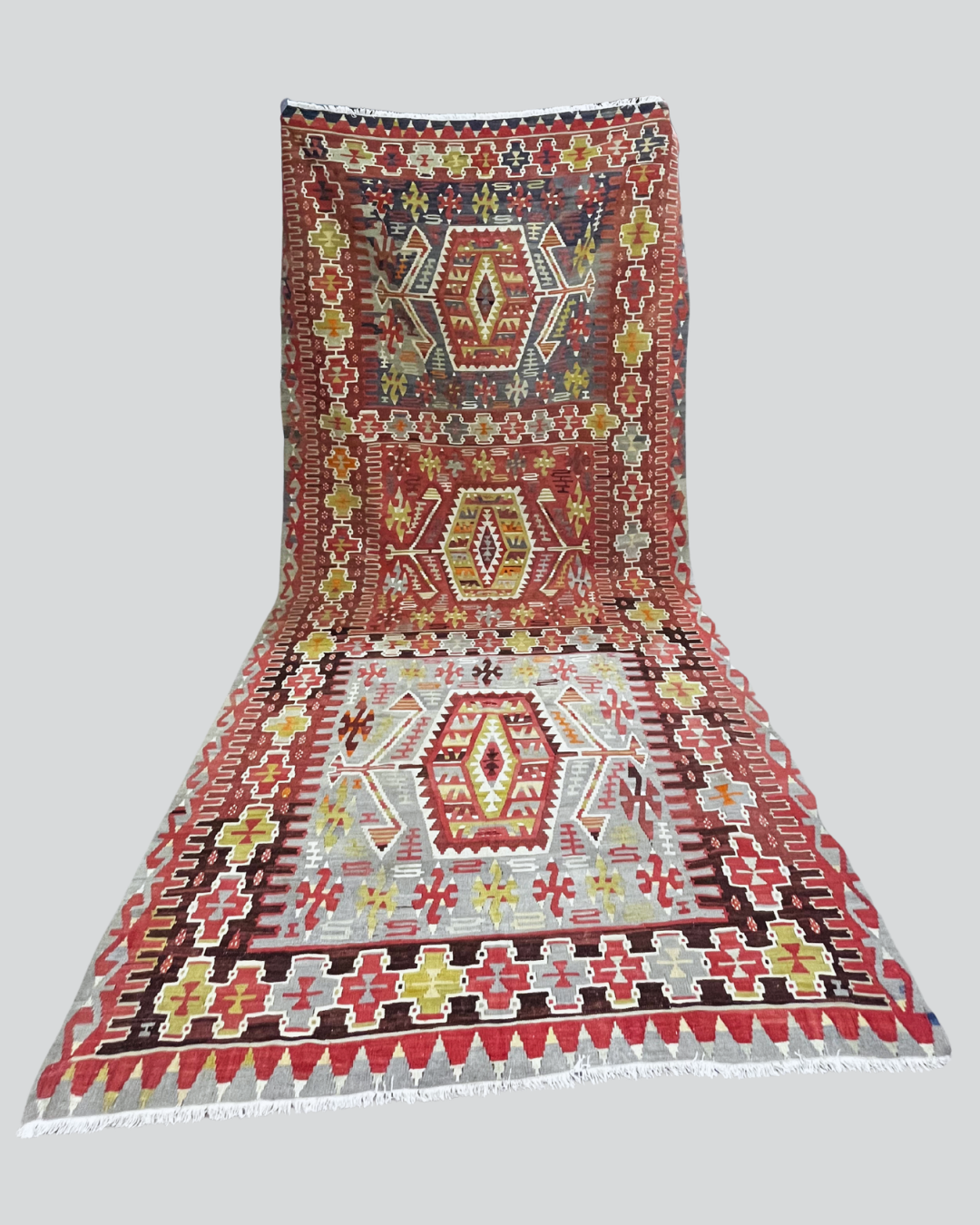 Decorative rug with geometric pattern on a plain background