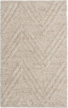 A rectangular rug with a subtle marled chevron pattern in creamy sand color, featuring a textured weave design.