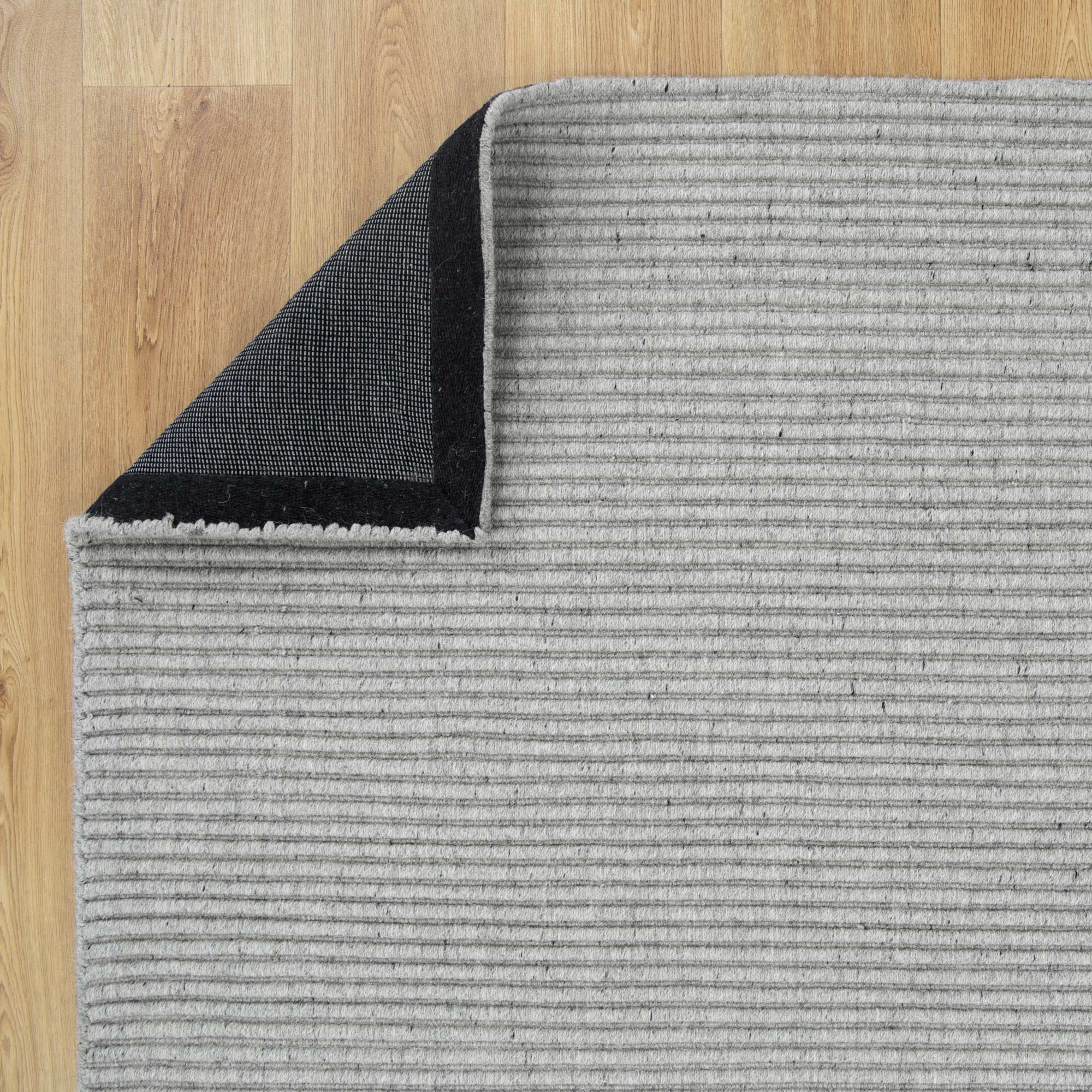 Image showing the natural and organic tone variations of the Zalia Grey Rug, emphasising its simple and elegant design.