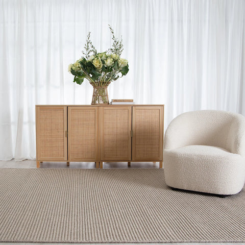 Zalia Handloom Putty Rug displayed in an elegantly furnished room, showcasing its ability to complement refined decor.