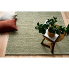 Avenue pesto rug in moder home with timber flooring and contemporary cushions
