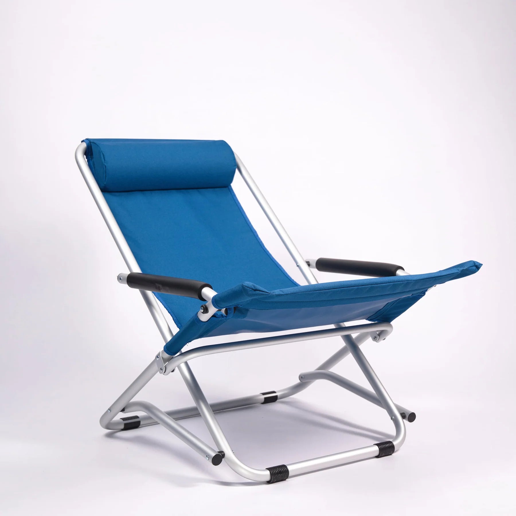 Blue folding chair with metal frame on a white background