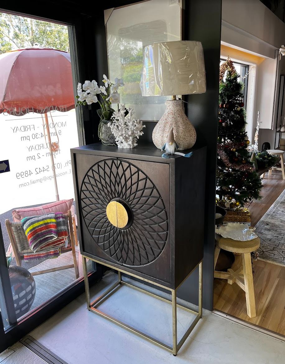 Decorative cabinet with intricate design in a home setting