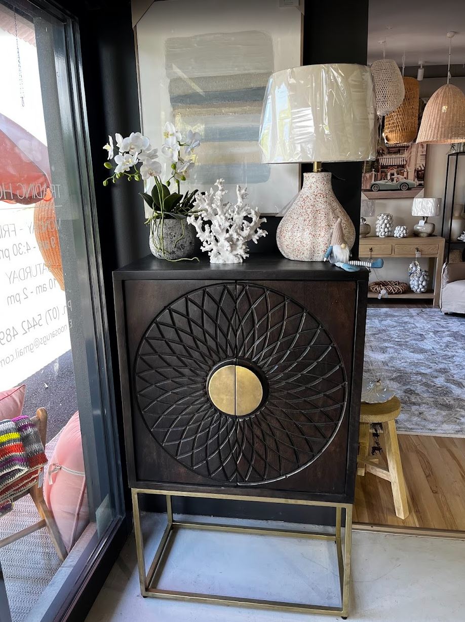 Decorative cabinet with intricate design in a home setting