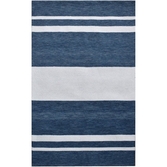 Striped blue and white rug on a white background