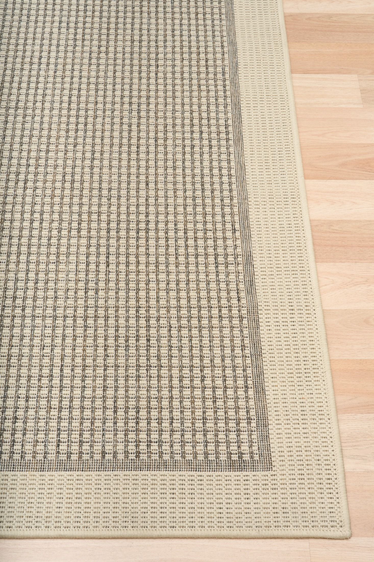 Chino rug in taupe linen that is latex backed on timber flooring