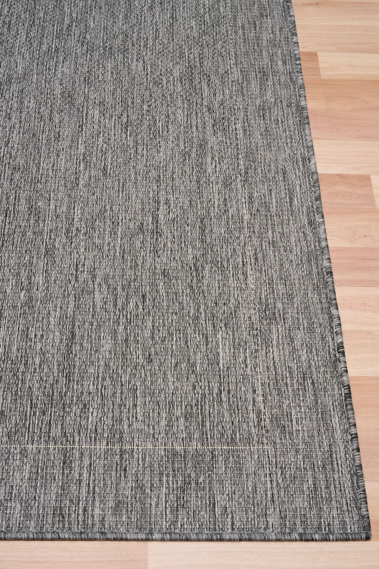 Chino silver white rug on timber flooring