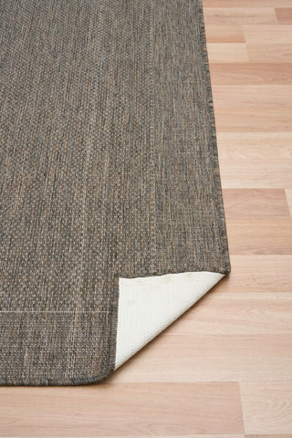 Chino rug showing its latex backing on a timber floor