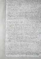 Textured gray rug on a concrete floor