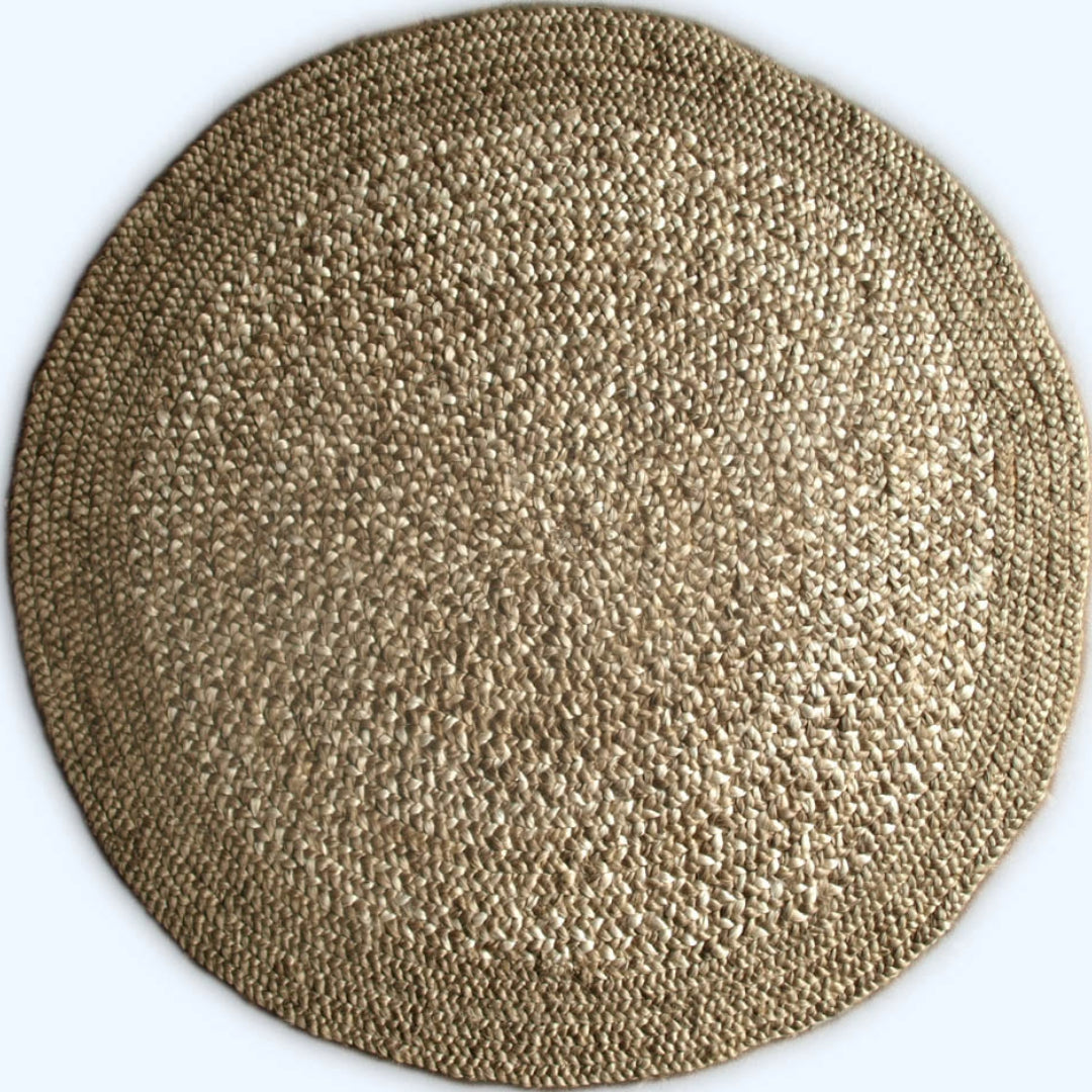 Round woven placemat with a textured pattern on a white background