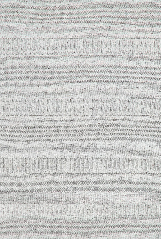Close-up view of a grey wool and nylon area rug with a textured pattern
