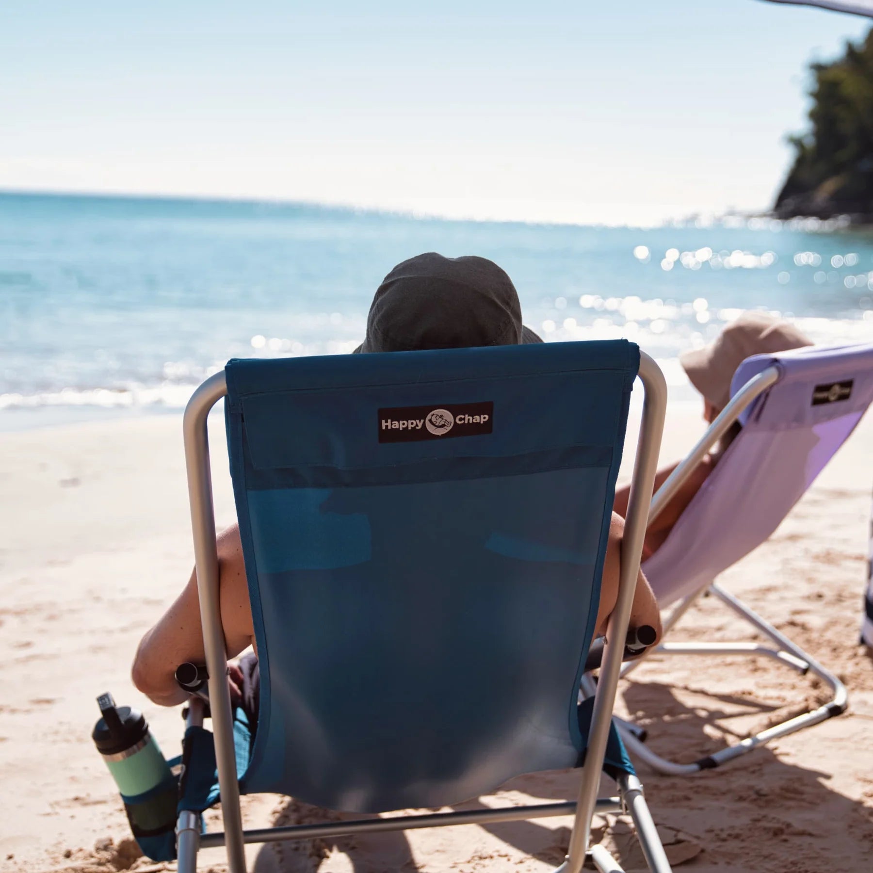 Happy chap chair on the beach at Noosa
