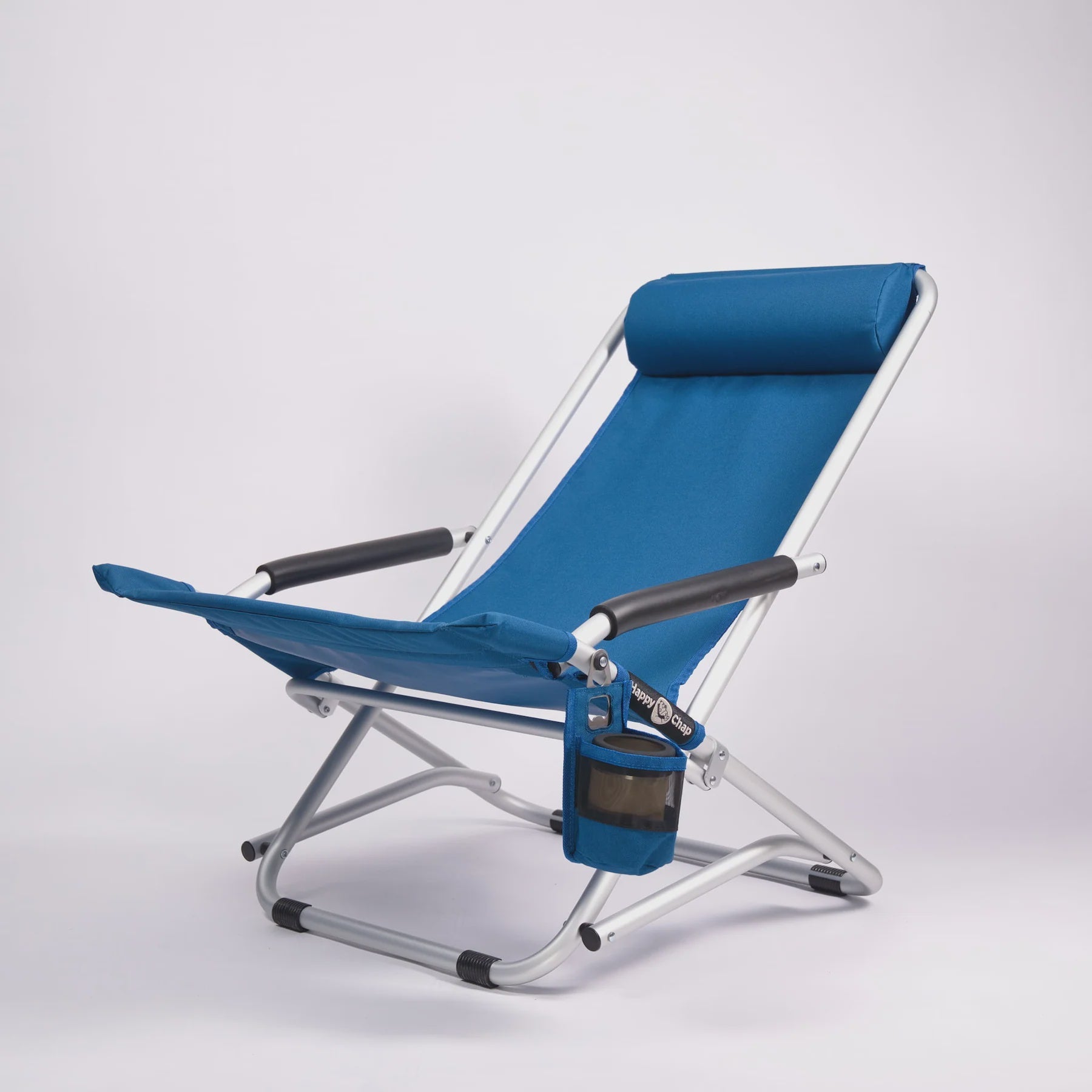 Blue folding beach chair with cup holder on a white background