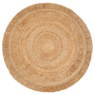 A round natural woven rug made from seagrass or straw, featuring concentric circular patterns and a fringed edge, shown from a top-down view on a white background.