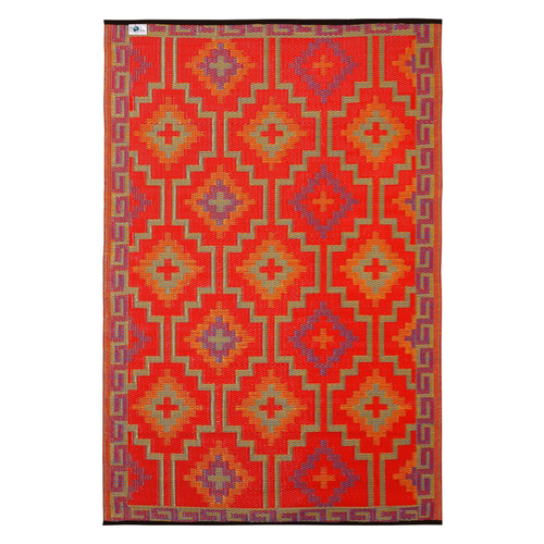 A rectangular woven rug with a bold geometric pattern in red, orange, purple, and beige, shown flat against a white background.