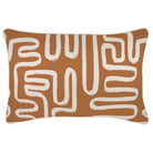 Decorative pillow with white abstract pattern on brown background