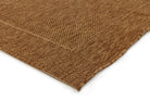Close-up of a brown textured fabric on a white background