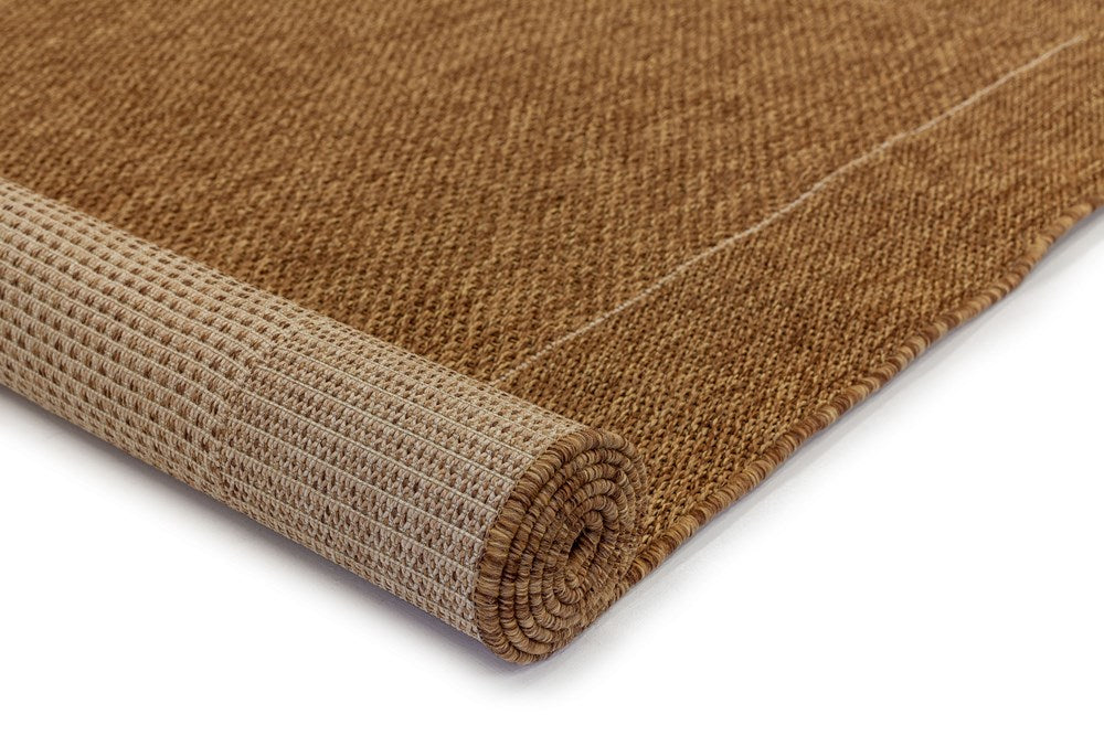 Brown textured rug on a white background