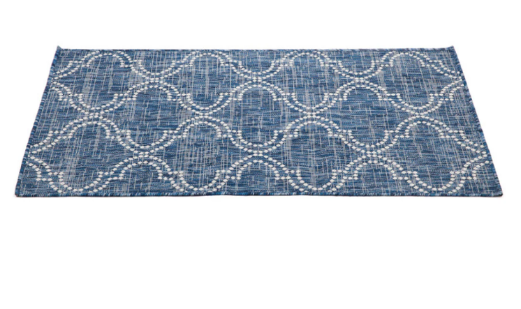 Blue patterned rug on a white background
