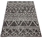 Black and white patterned rug on a white background