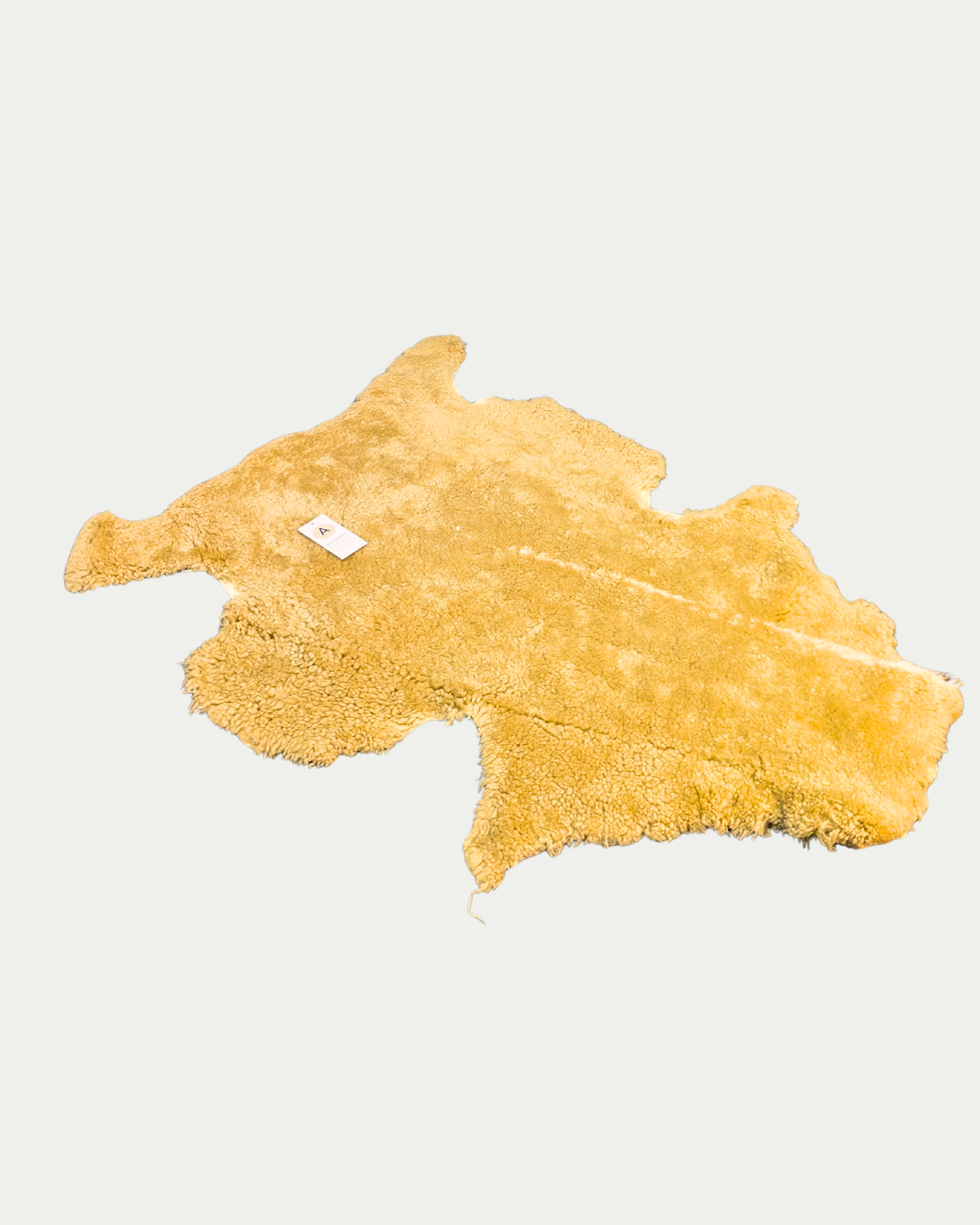 brown pet sheepskin rug on white backround