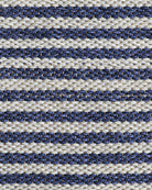 A close-up of a woven textile with horizontal stripes in navy blue and warm off-white, showing the detailed texture of the fibers.